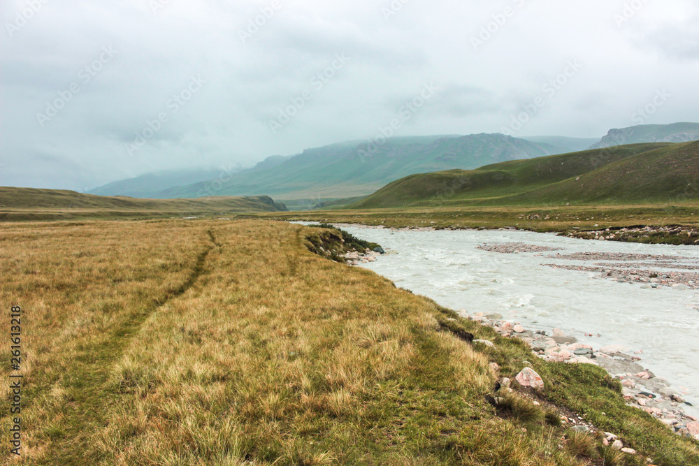 Φωτογραφία The steppes of Kyrgyzstan at the foot of the Tien Shan