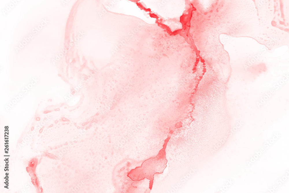 Red alcohol ink texture with abstract washes and paint stains on the white paper background. Red alcohol ink texture with abstract washes and paint stains on the white paper background.