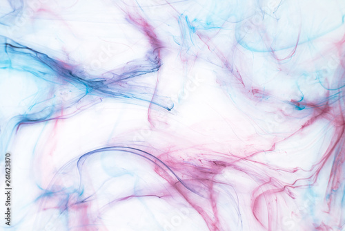 Colorful alcohol ink texture with abstract washes and paint stains on the white paper background. 