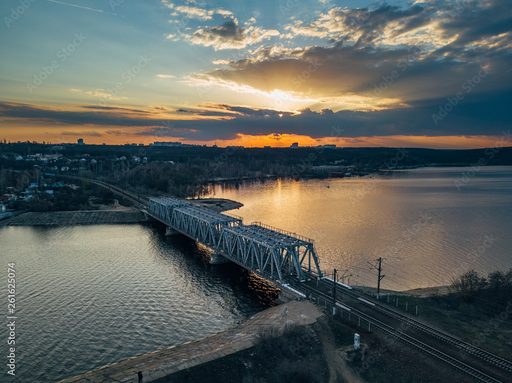 Sunset above railway bridge over Voronezh water reservoir