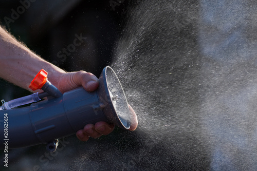 Water splash from automizer,Agricultural atomizer spraying pesticides photo