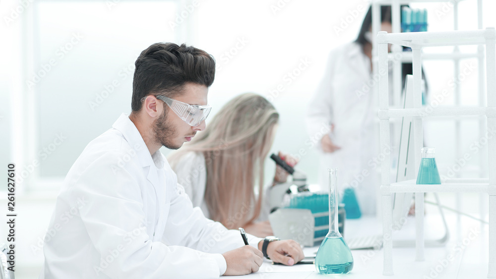 close up.the scientist writes data to the log. close up.the scientist writes data to the log.