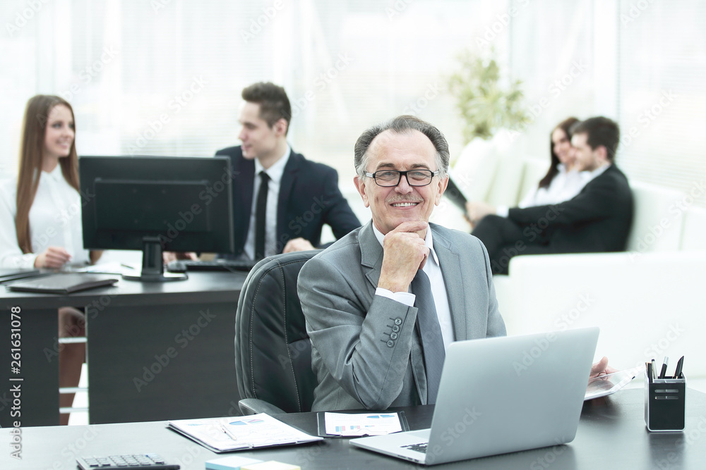 portrait of adult businessman at the Desk in the office portrait of adult businessman at the Desk in the office