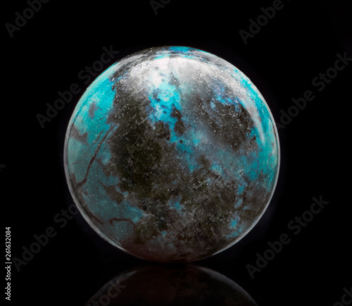 Mineral Unakite with reflection on black surface background