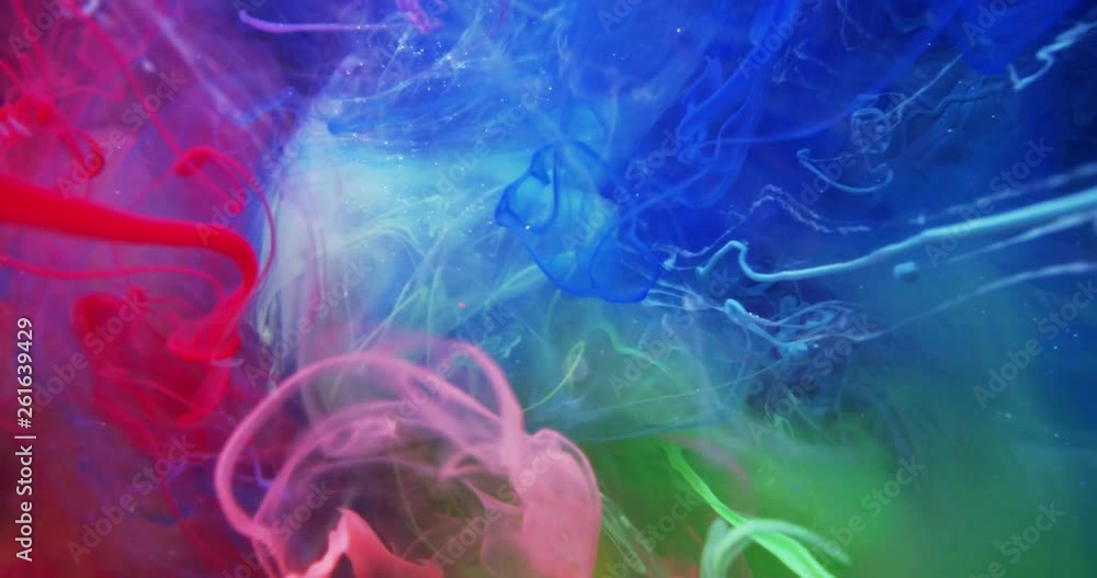 Colorful Rainbow Paint Threads and Drops Mixing in Water. Ink swirling. Underwater 4K Macro Shot. Colorful Rainbow Paint Threads and Drops Mixing in Water. Ink swirling. Underwater 4K Macro Shot.