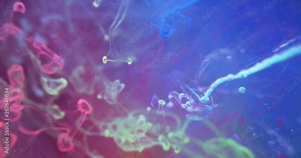 Colorful Rainbow Paint Threads and Drops Mixing in Water. Ink swirling. Underwater 4K Macro Shot. Colorful Rainbow Paint Threads and Drops Mixing in Water. Ink swirling. Underwater 4K Macro Shot.