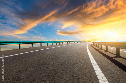 Empty asphalt road ground and beautiful sky clouds at sunset