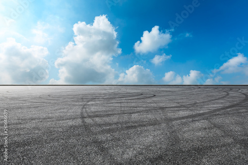 Empty asphalt race track ground and beautiful sky clouds © ABCDstock
