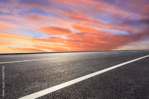 Empty asphalt road ground and beautiful sky clouds at sunset © ABCDstock