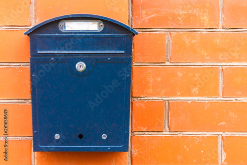 A beautiful mailbox hangs waiting for newspapers, parcels and letters.