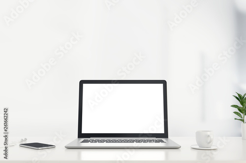 Mock up work space laptop with blank screen on office desk. 3d rendering