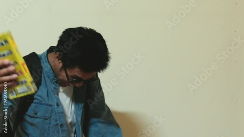 Man asian Overdo reading work without break For education to insupportable insufferable strain throwing the book on wall background