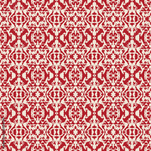 Abstract seamless pattern with mirrored symmetrical  marbled shapes in red and cream.