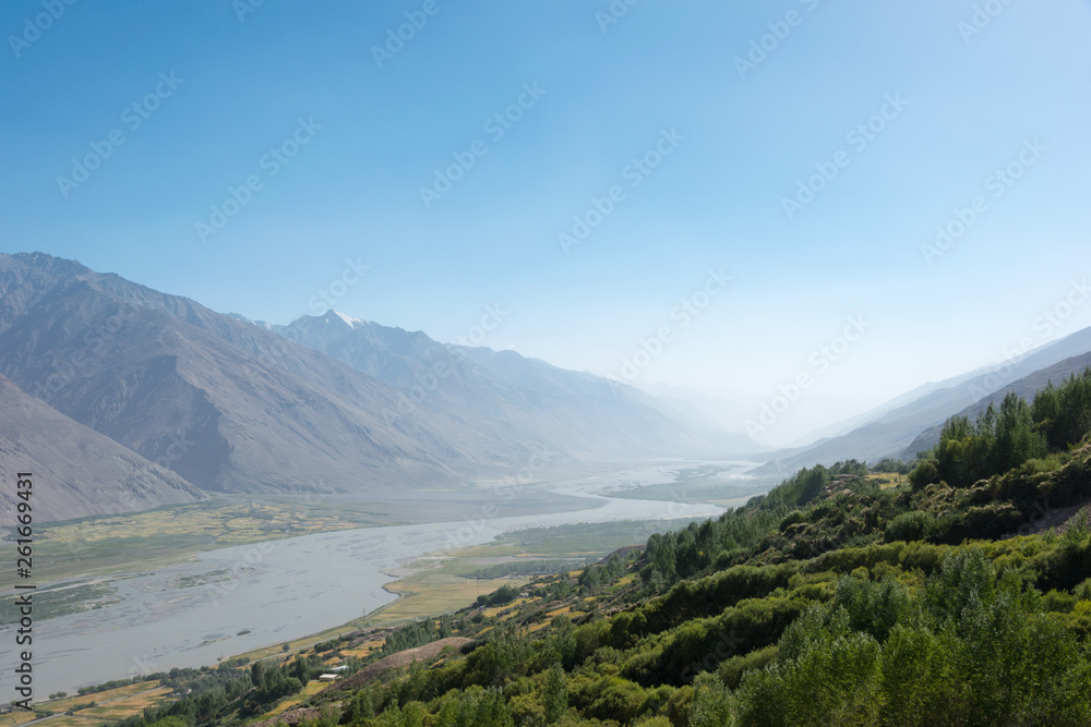 Pamir Mountains, Tajikistan - Aug 22 2018: Panj river at Wakhan Valley in Yamchun, Gorno-Badakhshan, Tajikistan. It is located in the Tajikistan and Afghanistan border.