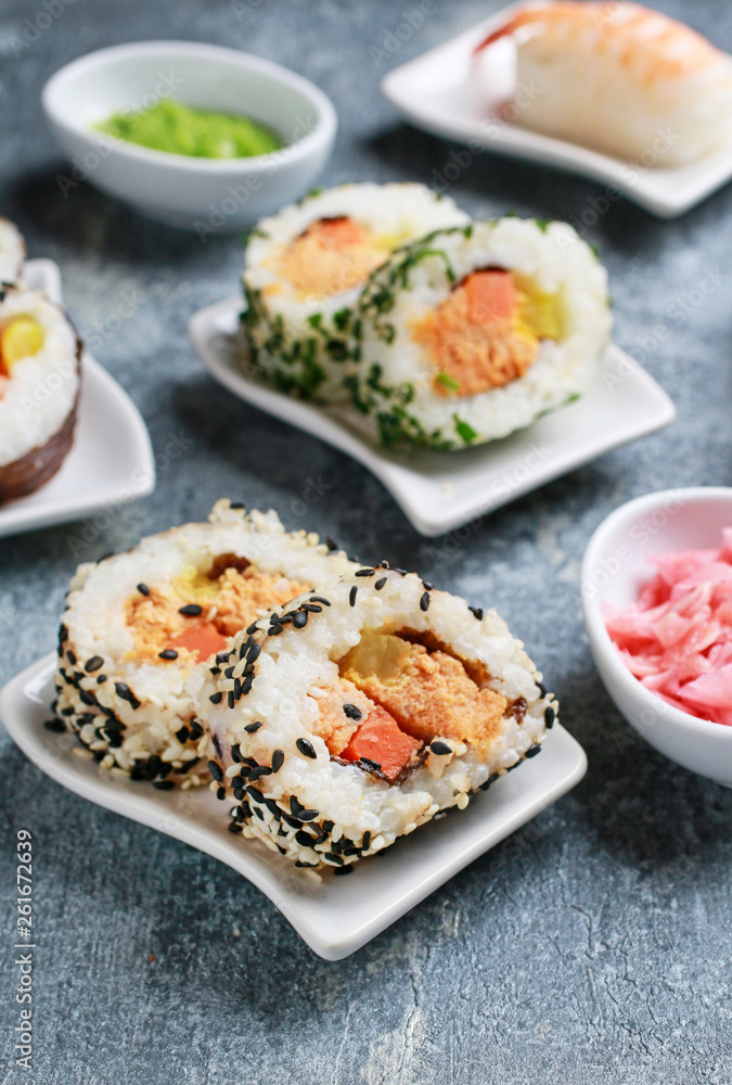 Sushi set on grey stone background.
