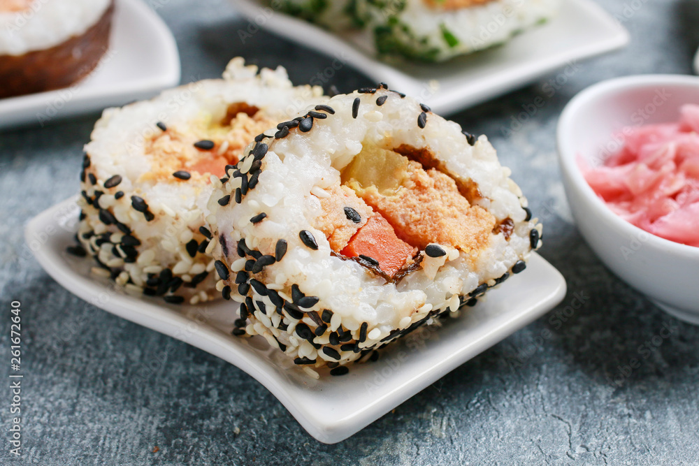 Sushi set on grey stone background. Sushi set on grey stone background.