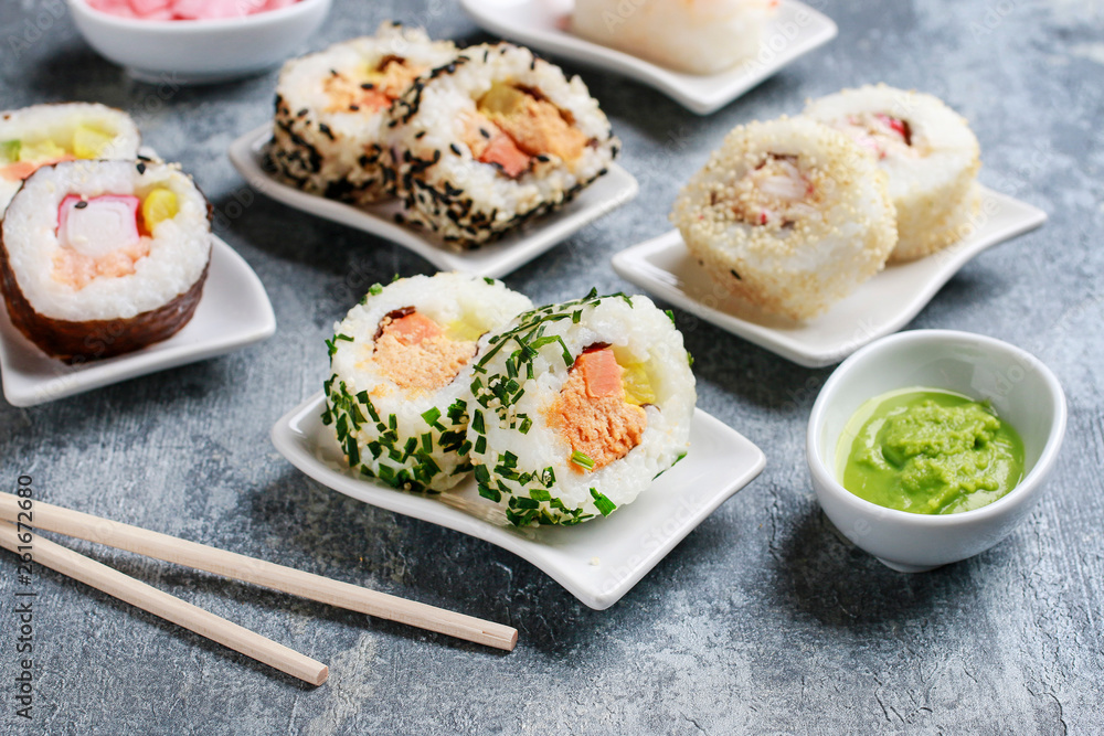 Sushi set on grey stone background.