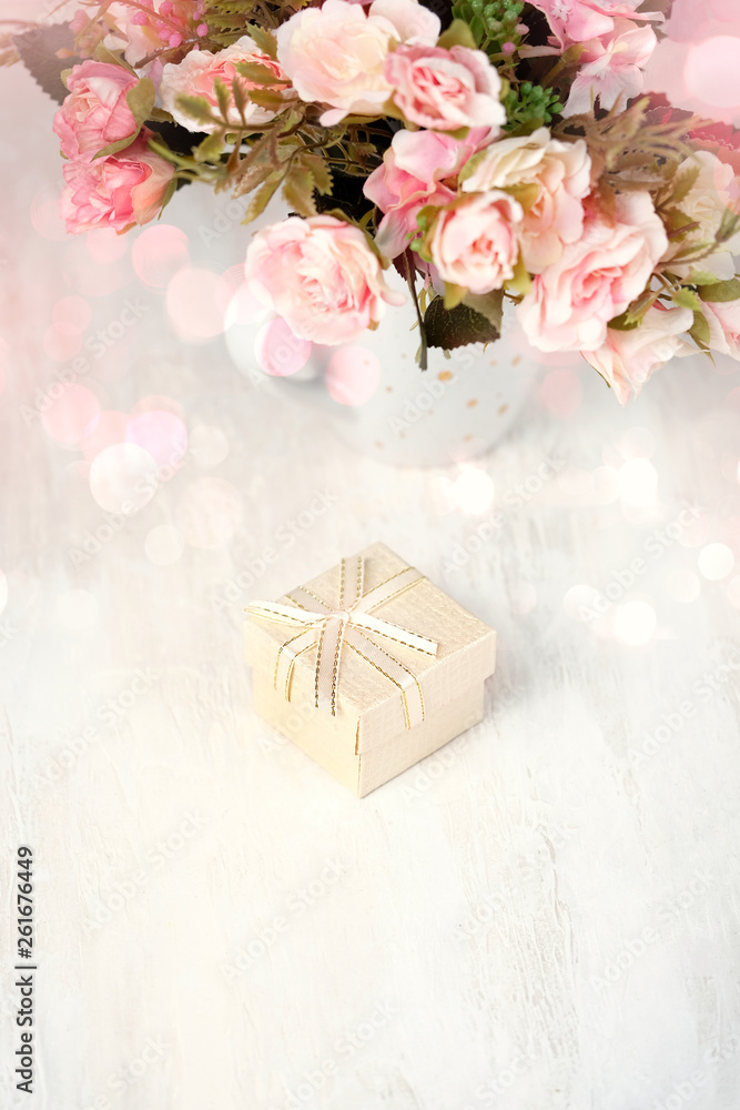 greeting card, flowers and gift box on light background. Holiday spring season, festive design, Mother`s day, Valentine's day, birthday. Soft focus, copy space greeting card, flowers and gift box on light background. Holiday spring season, festive design, Mother`s day, Valentine's day, birthday. Soft focus, copy space