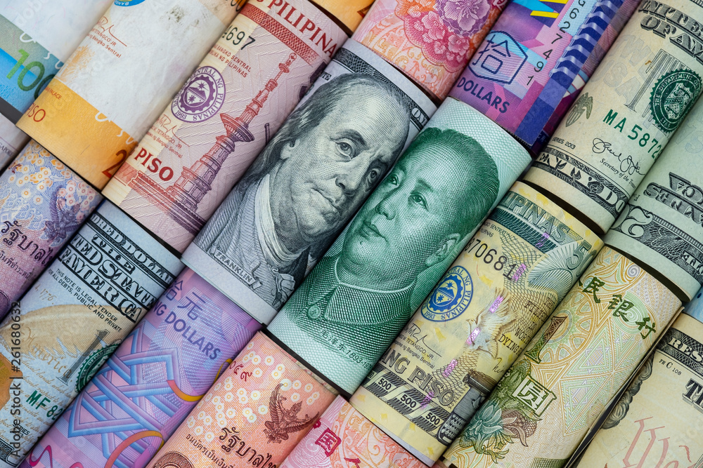 US dollar and China Yuan banknote with multi countries banknotes. Its is symbol for tariff trade war crisis or unfair business of 2 biggest economic countries in the world. US dollar and China Yuan banknote with multi countries banknotes. Its is symbol for tariff trade war crisis or unfair business of 2 biggest economic countries in the world.