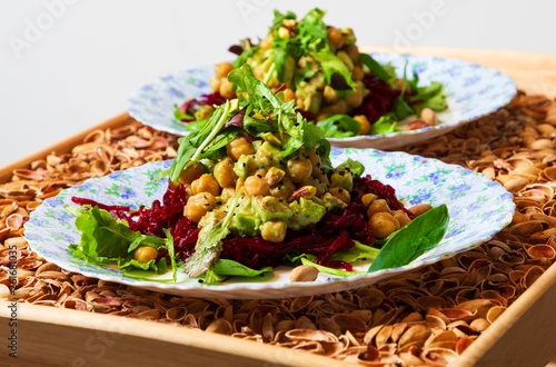 Fresh vegeterian salad on the plates photo