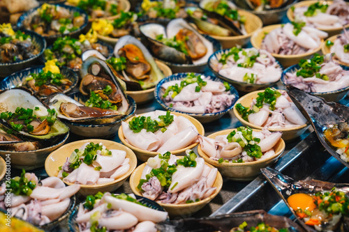 Street food at night in Phu Quoc island in Vietnam | Delicious seafood for tourist at market photo