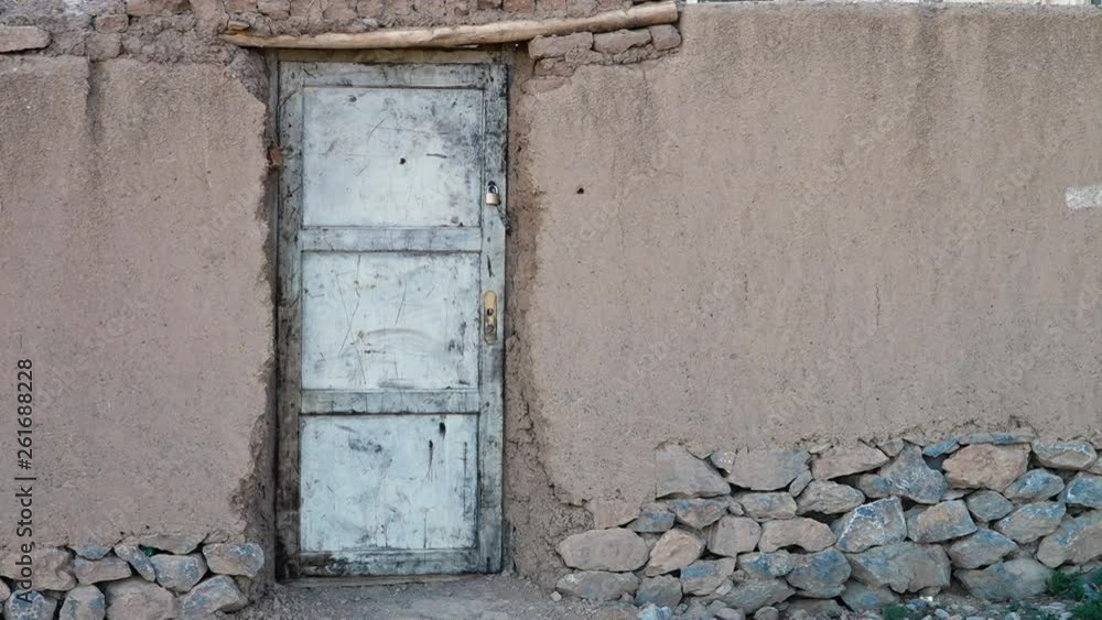 The plaster of the building reveals old stone work below. The plaster of the building reveals old stone work below.