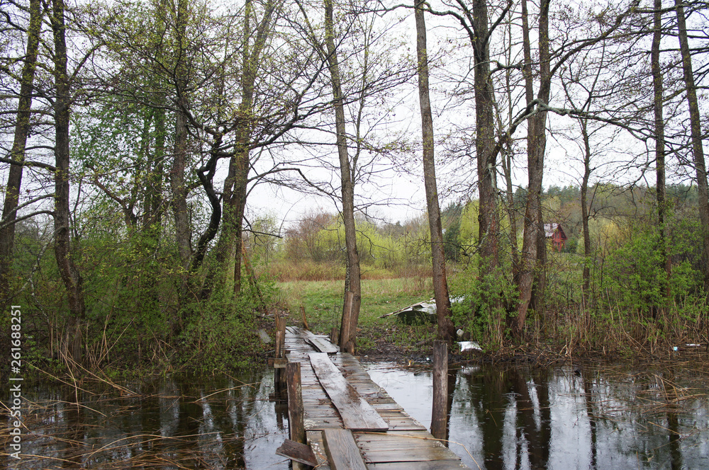 Old village bridge over the river and creek. Old village bridge over the river and creek.
