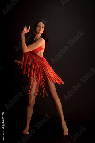 sexy dancer in red on a black background