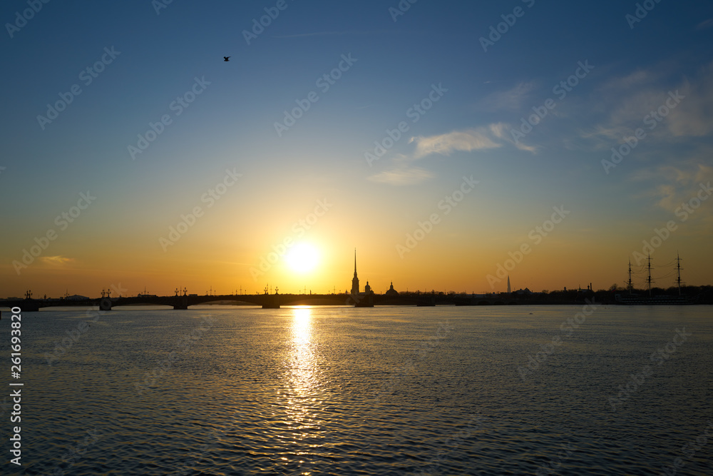 sunset over the river, St. Petersburg, view of the city of Peter and Paul Tower and the new tower lahta center.