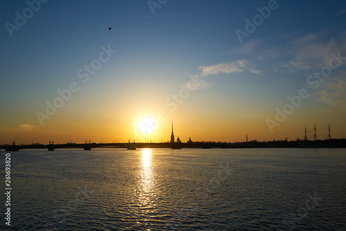 sunset over the river, St. Petersburg, view of the city of Peter and Paul Tower and the new tower lahta center.