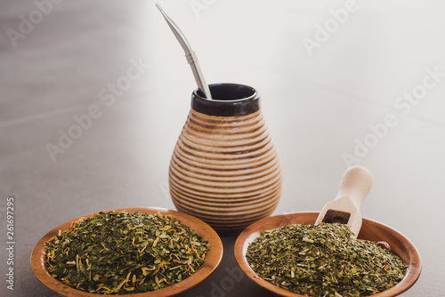 Yerba Mate tea on neutral stone gray backgrund. Healthy, energy boosting beverage drink on neutral stone gray backgrund. photo