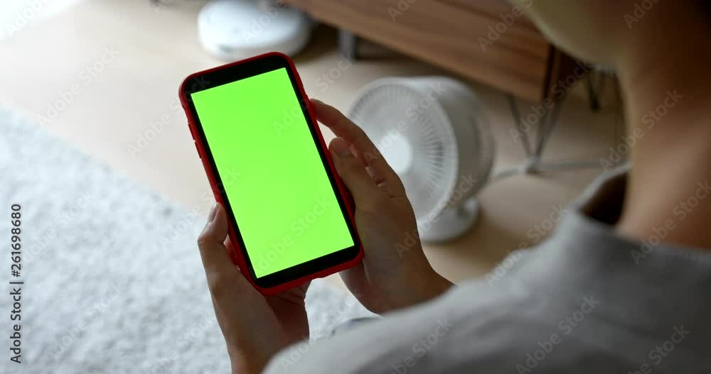 Woman use of mobile phone with chroma key at home Woman use of mobile phone with chroma key at home
