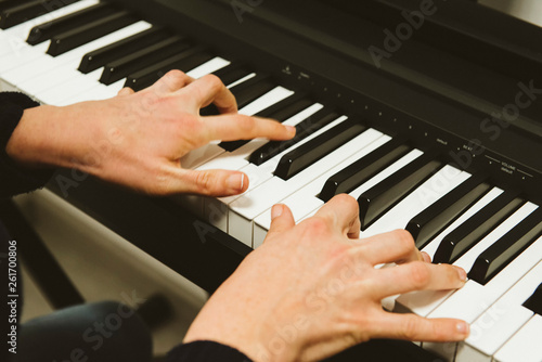 hands of a woman playing piano © Fernando
