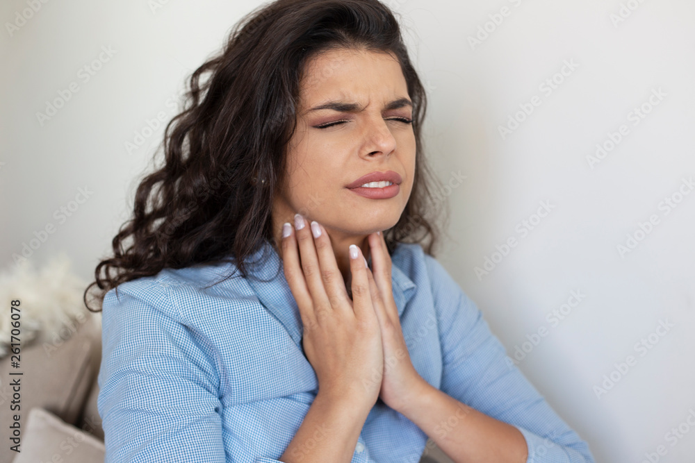 Portrait of a woman with throat pain Portrait of a woman with throat pain