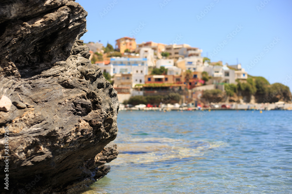 Mediterranean sea coast. Calm clear water, rocks. Sunny day. Closeup