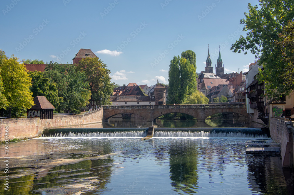Picturesque view of river Pegnitz in Nuremberg with water reflections.
