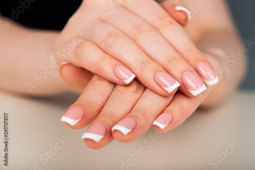 Beautiful woman s hands with beautiful nails after manicure salon with french manicure