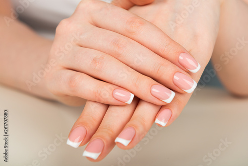 Beautiful woman s hands with beautiful nails after manicure salon with french manicure
