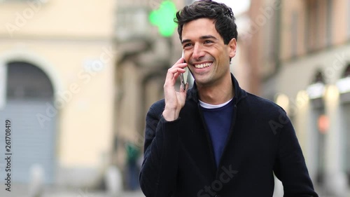 Young man talking on the phone outdoor