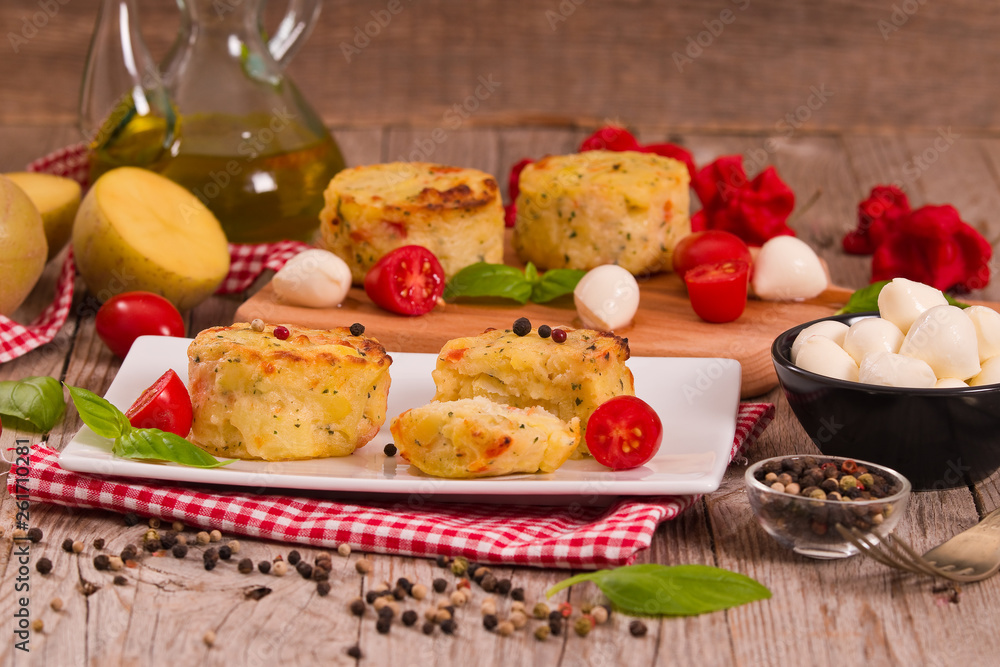 Potato gratins with mozzarella and tomatoes. Potato gratins with mozzarella and tomatoes.