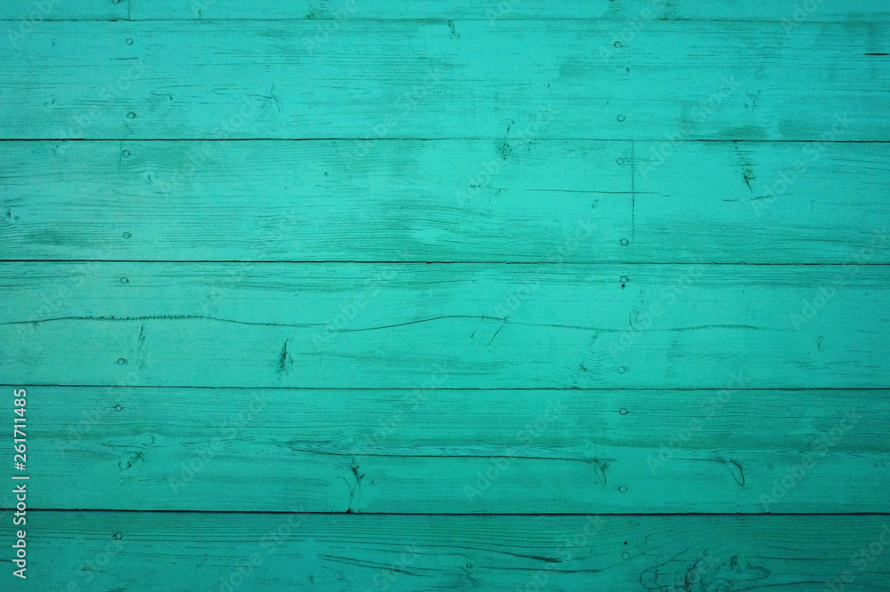 Obraz premium Background from old shabby wooden boards. Turquoise wood texture with peeling paint
