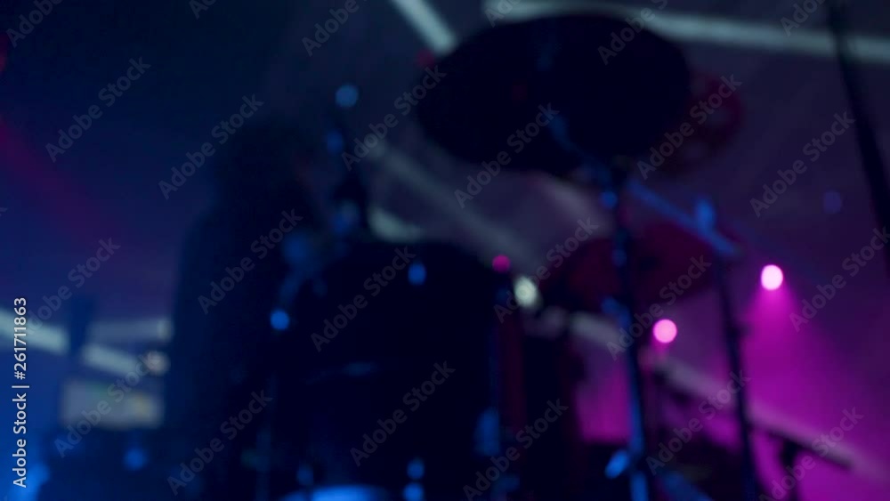 Drummer performing at a rock concert. Man play drums at a music festival. Drummer performing at a rock concert. Man play drums at a music festival.