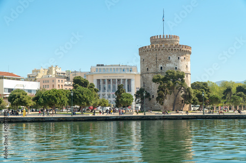 Thessaloniki / Greece 11 April 2019 the blue sea and the white tower of thessaloniki city's symbol and landmark ,beautiful sunny day after long time of rain and clouds great opportunity for a walk.