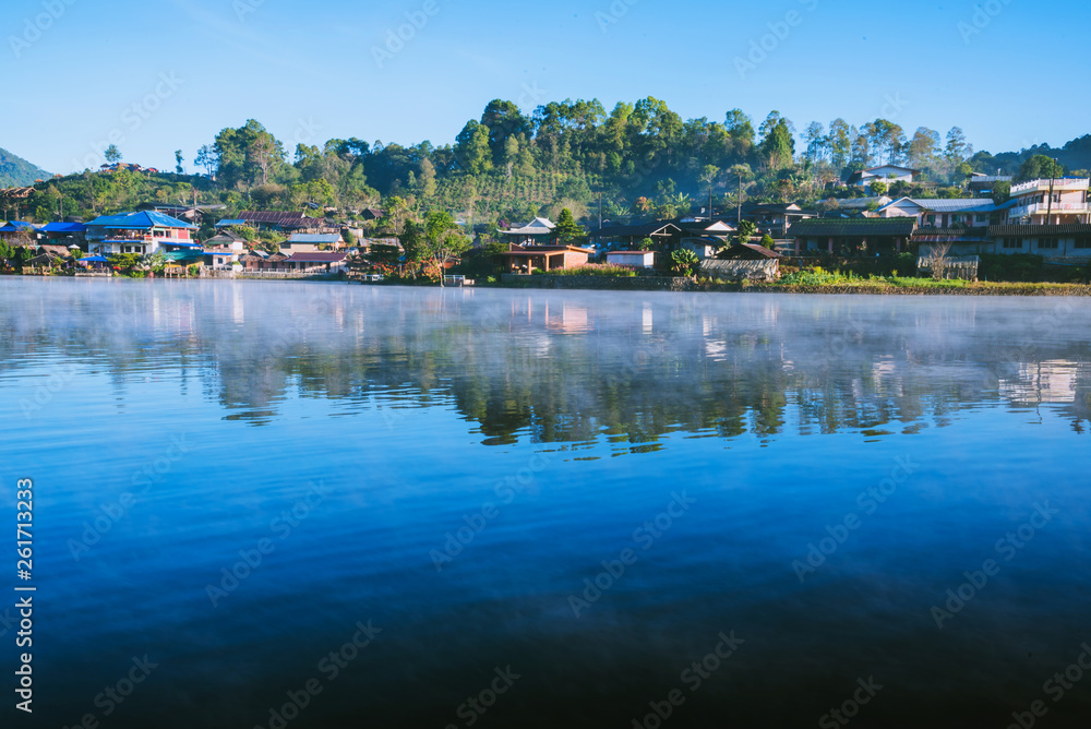 The beauty of the mist that rose from the surface of the lake in the morning At Ban Rak Thai village, in Thailand.