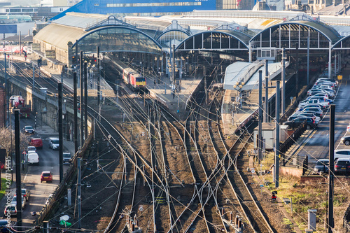 Newcastle Central railway station and multiple tracks of the east coast main line with an express train at the platform