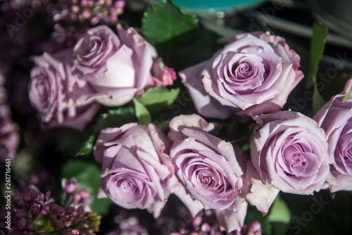 bouquet of purple roses in a basket for sale
