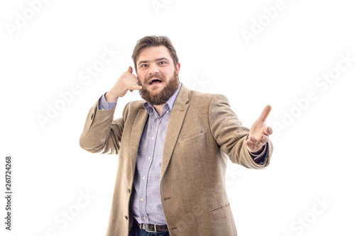 Portrait of funny big handsome smiling bearded business man in beige suit, isolated on white