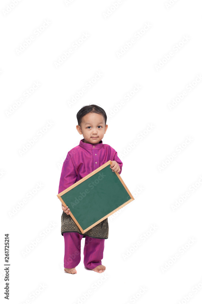 Boy holding a blank black board wearing traditional costume Boy holding a blank black board wearing traditional costume