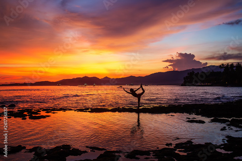 Caucasian woman practicing yoga at seashore © Maygutyak