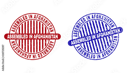 Grunge ASSEMBLED IN AFGHANISTAN round stamp seals isolated on a white background. Round seals with grunge texture in red and blue colors.